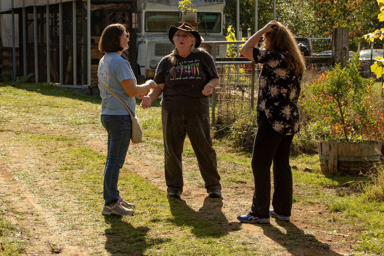 Laura Sweany, center, talks to visitors during the Onalaska Apple Harvest Festival farm and homestead tour on Sunday, Oct. 8, at her farm, LaCamas Creek Farm.