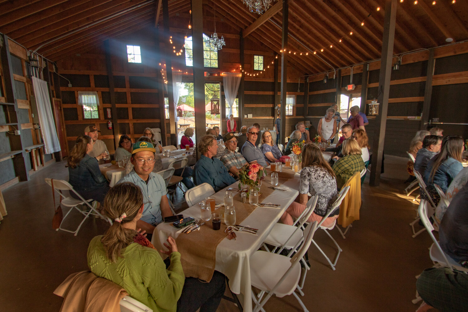 Guests gather at The Mason Jar event center on Sunday, Oct. 8 for the farm to table dinner, the final event of the Onalaska Apple Harvest Festival.