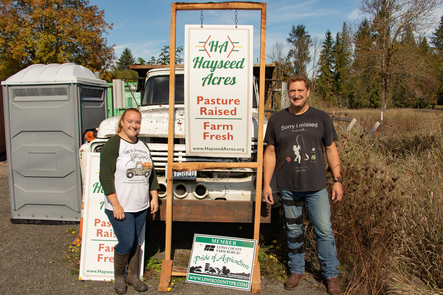 Jerry McFarland and Cassie Scott stand outside of McFarland's farm, Hayseed Acres, in Onalaska on Sunday, Oct. 8.