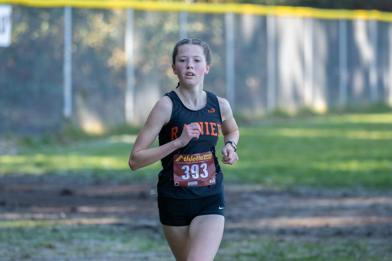 Madison Ingram crosses the finish line to take first in the girls' race at the 1B/2B District 4 cross country championship meet on Oct. 28 in Rainier.