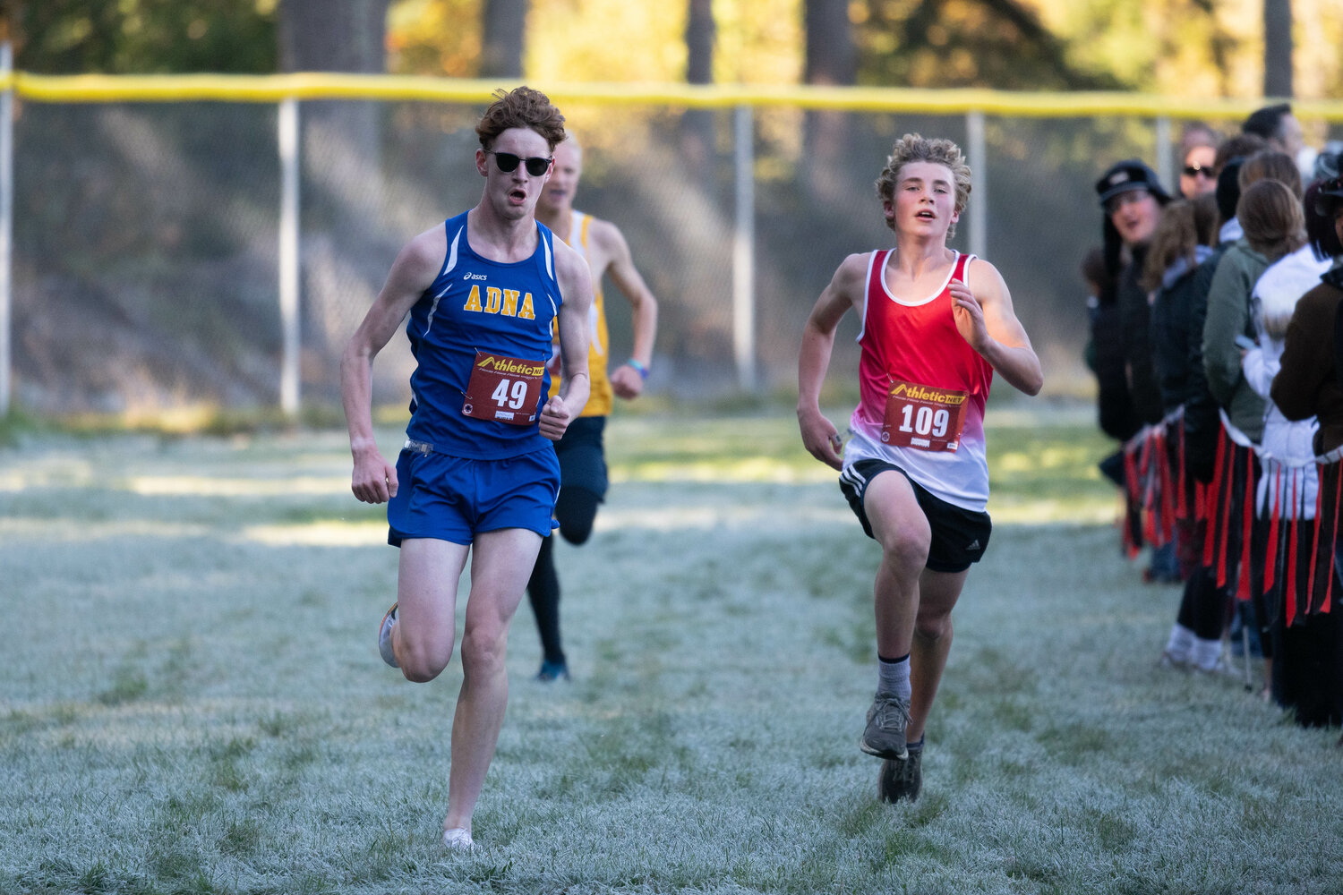 Adna's Bailey Davis (left) beats out Oakville's Cecil Gumaelius (right) down the homestretch in the boys' race at the 1B/2B District 4 cross country championship meet on Oct. 28 in Rainier.