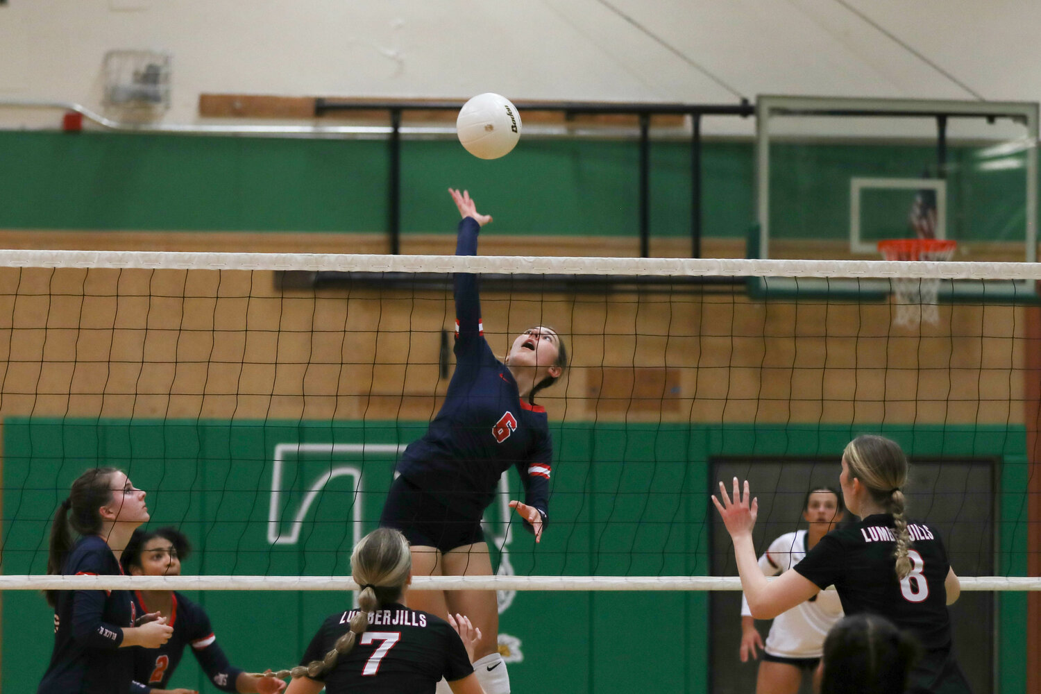 Ellie Johnson leaps to spike the ball during Black Hills' 3-2 win over R.A. Long in the first round of the 2A District 4 Tournament on Nov. 2 in Tumwater.
