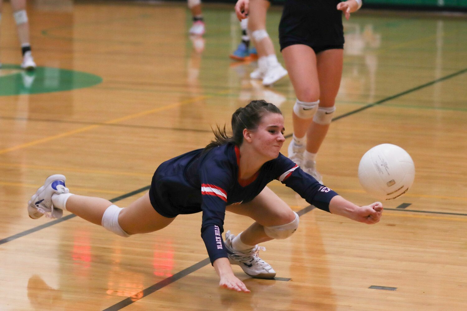 Lilly Kincaid dives to keep a ball in play during Black Hills' 3-2 win over R.A. Long in the first round of the 2A District 4 Tournament on Nov. 2 in Tumwater.
