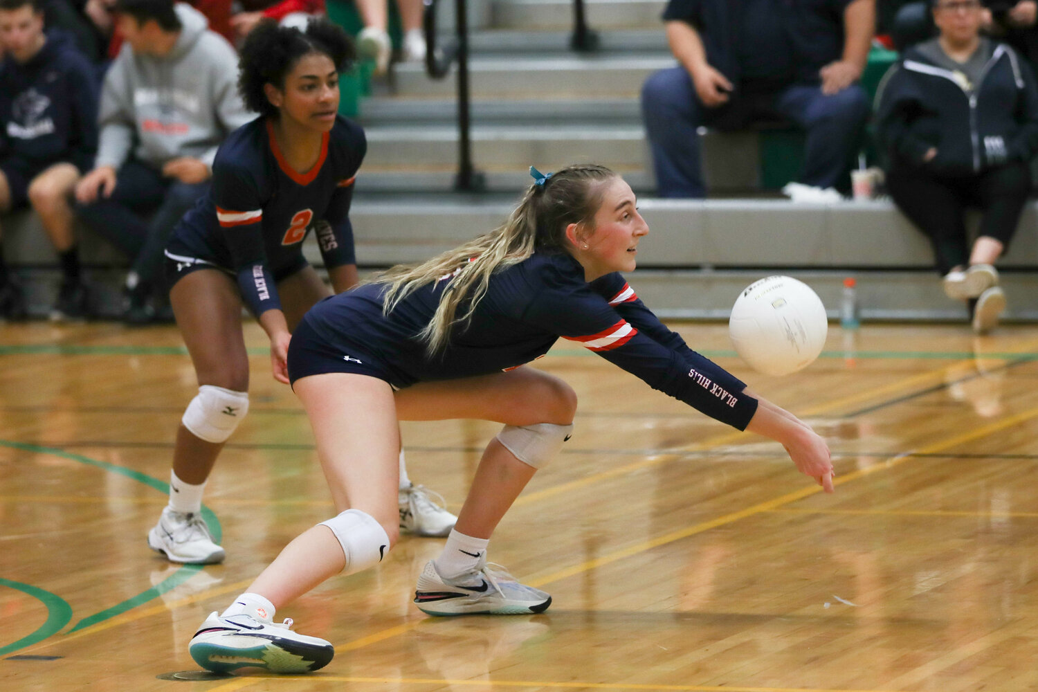 Claire Johnson lunges to her left to dig a ball during Black Hills' 3-2 win over R.A. Long in the first round of the 2A District 4 Tournament on Nov. 2 in Tumwater.