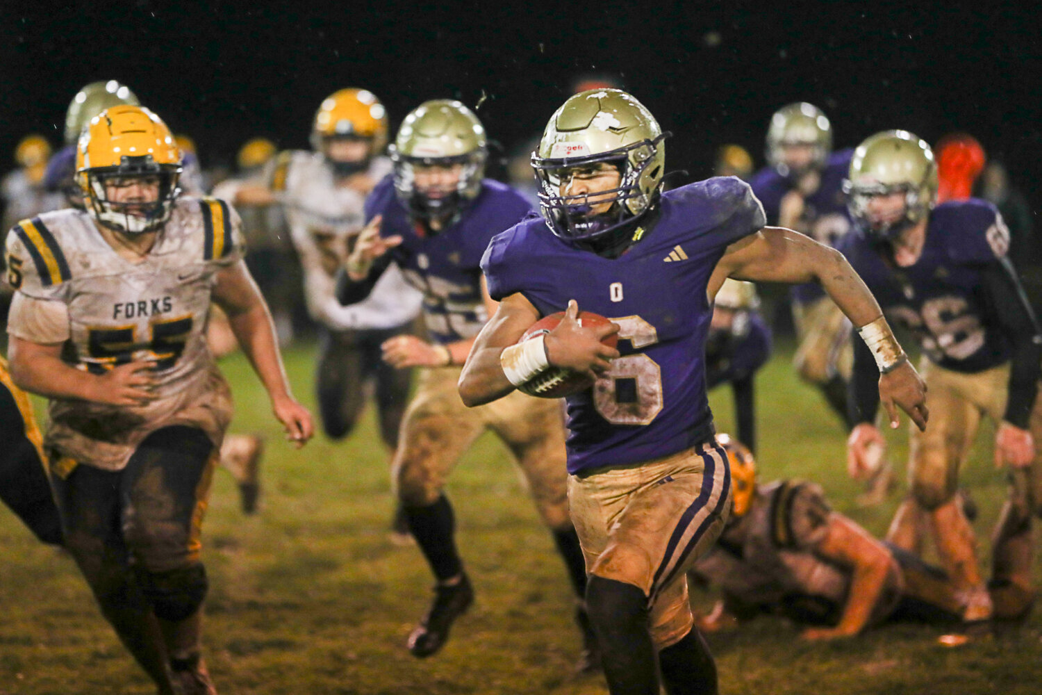Rodrigo Rodriguez hits the left sideline during the second half of Onalaska's 20-7 win over Forks in a district crossover on Nov, 3,