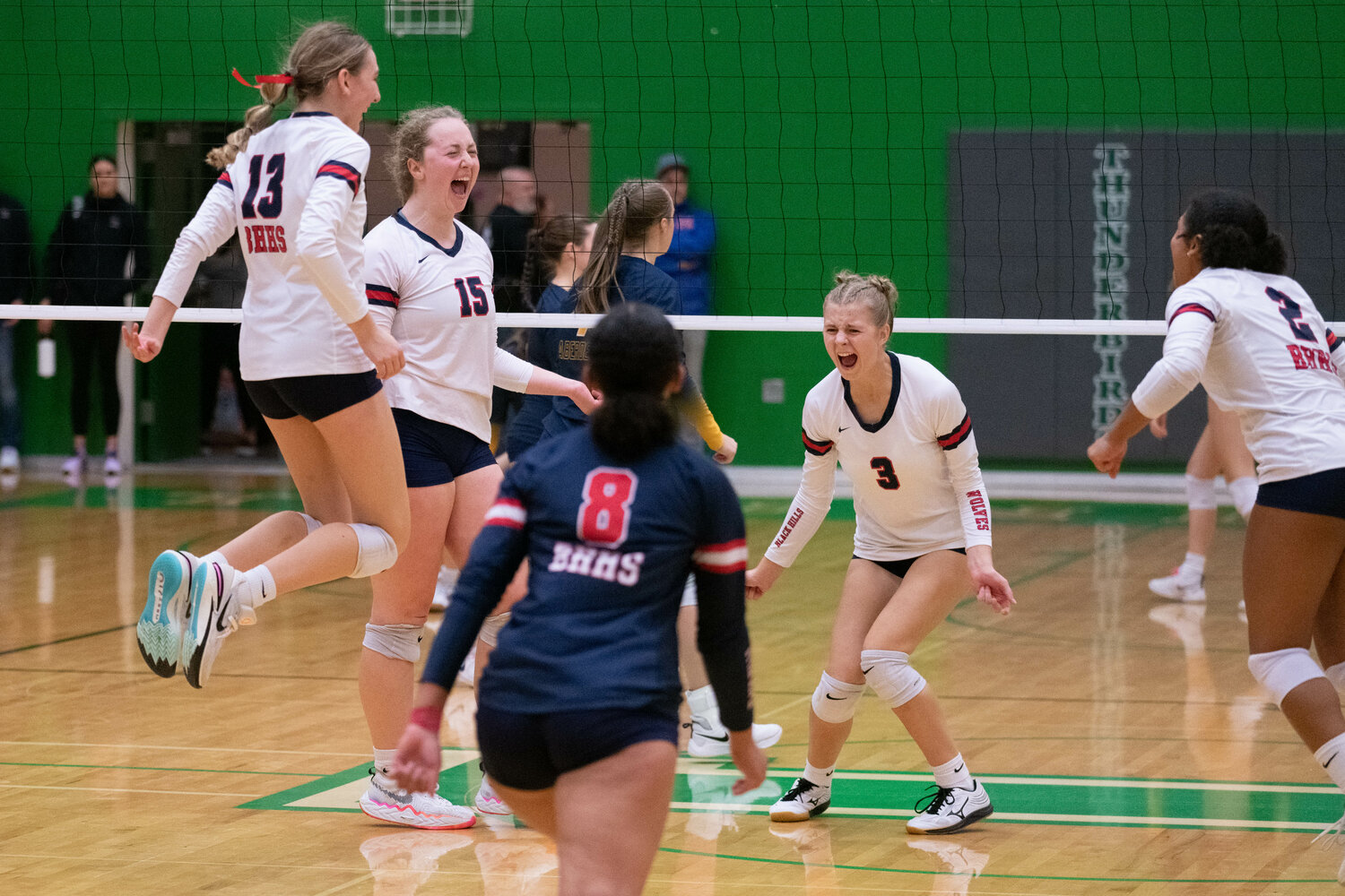 Black Hills celebrates the match-winning point in its four-set win over Aberdeen in a district winner-to-State match, Nov. 4 at Tumwater.