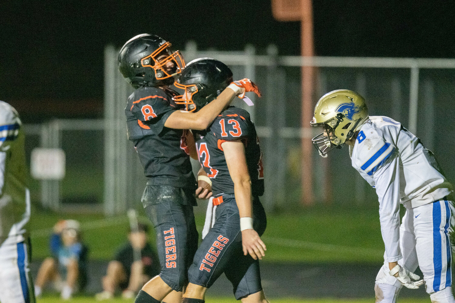 Conner Holmes (13) celebrates his touchdown with James Grose in the first half of Napavine's crossover game against Adna on Nov. 4.