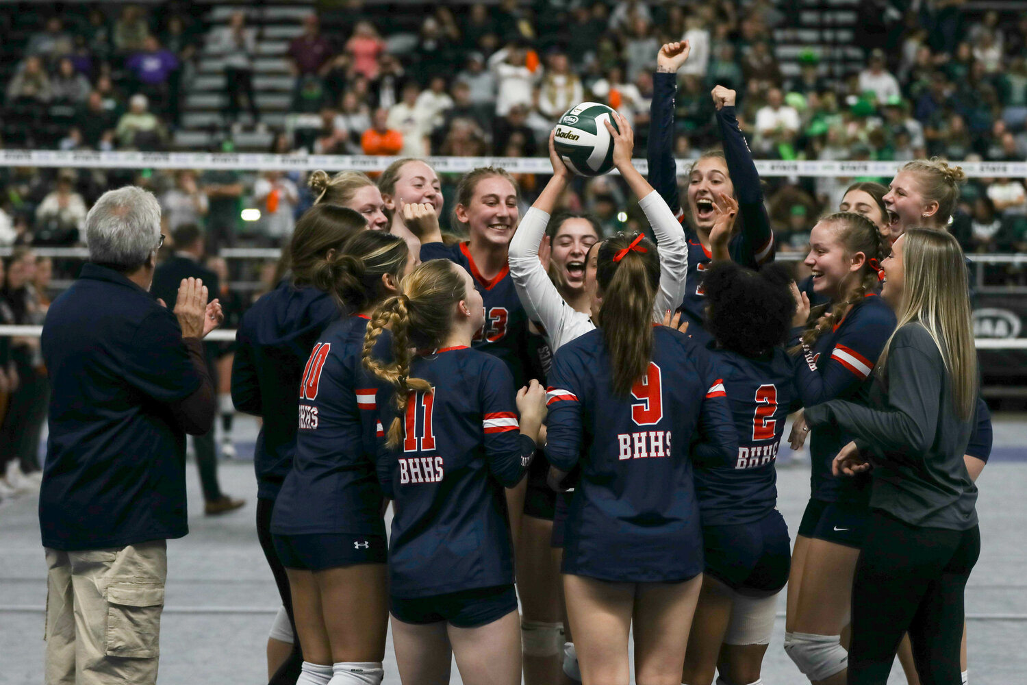 The Wolves celebrate after finishing eighth at the state tournament on Nov. 11 in Yakima.