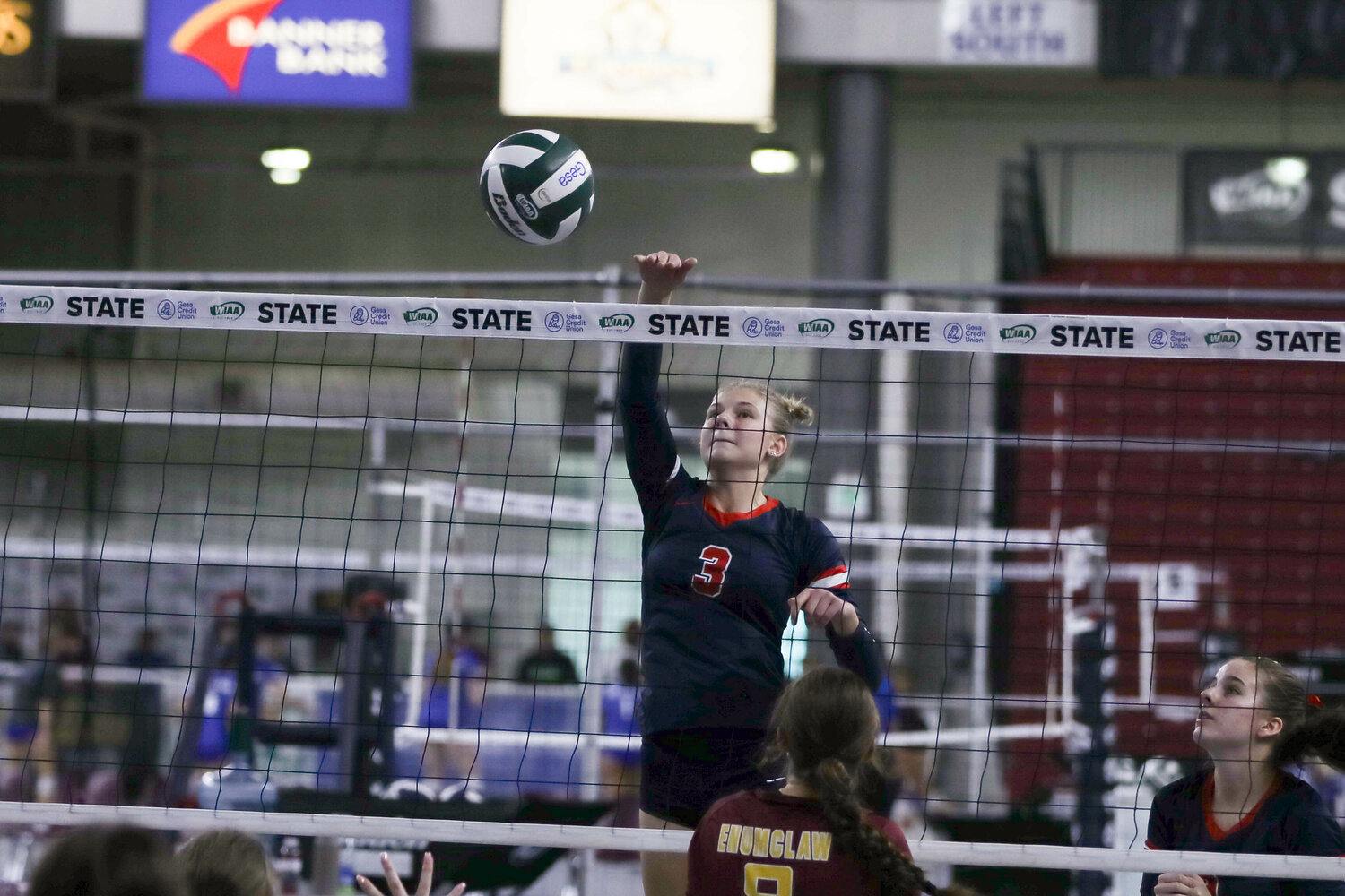 Ella Goheen bats the ball over the net during Black Hills' win over Enumclaw at the state tournament on Nov. 11 in Yakima.