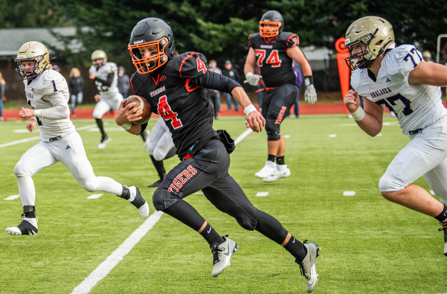 Napavine quarterback Ashton Demarest takes the football down the line against the Onalaska Loggers in Tumwater on Saturday at the 2B state semifinals.
