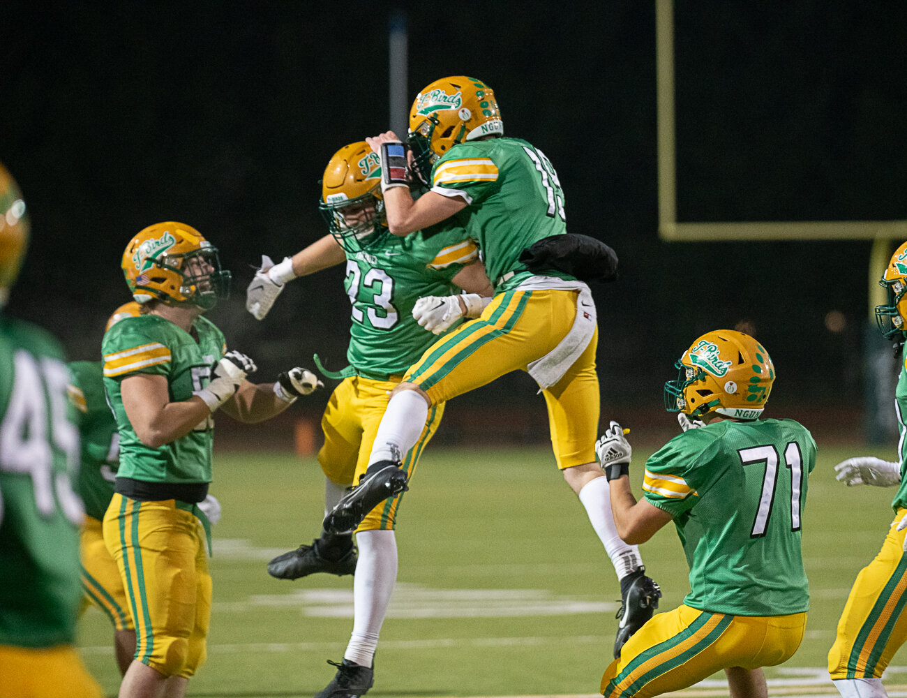 Ethan Kastner (19) and Cash Short (23) celebrate at the end of Tumwater's 19-17 win over North Kitsap in the 2A state semifinals on Nov. 25.