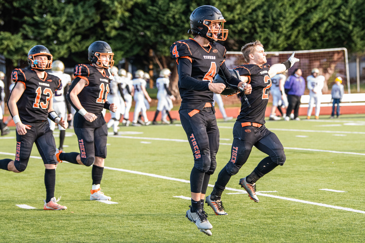Napavine quarterback Ashton Demarest jumps for joy while celebrating with running back Cael Stanley after beating Onalaska in the 2B state semifinals to advance to the State Championship.