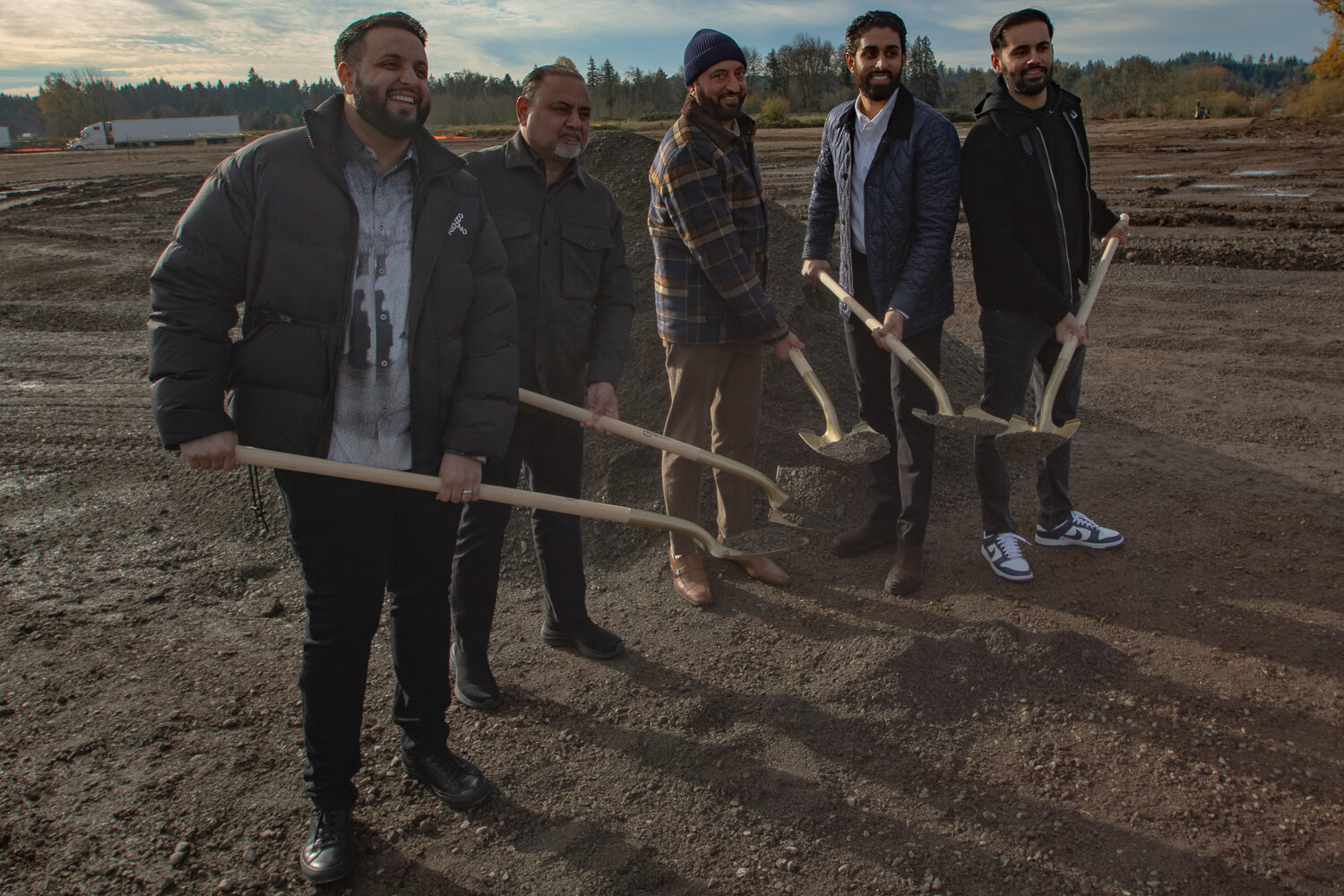 From the left, TA Napavine co-owner Damanjit Singh, Sukhdeep Multani, Inderjit Singh, TA Napavine co-owner Gurinderjit Sidhu, TA Napavine co-owner Manpreet Singh post for a photo during a ceremonial groundbreaking event for a new TA truck stop in Napavine held on Nov. 21 on 121 Hamilton Rd.
