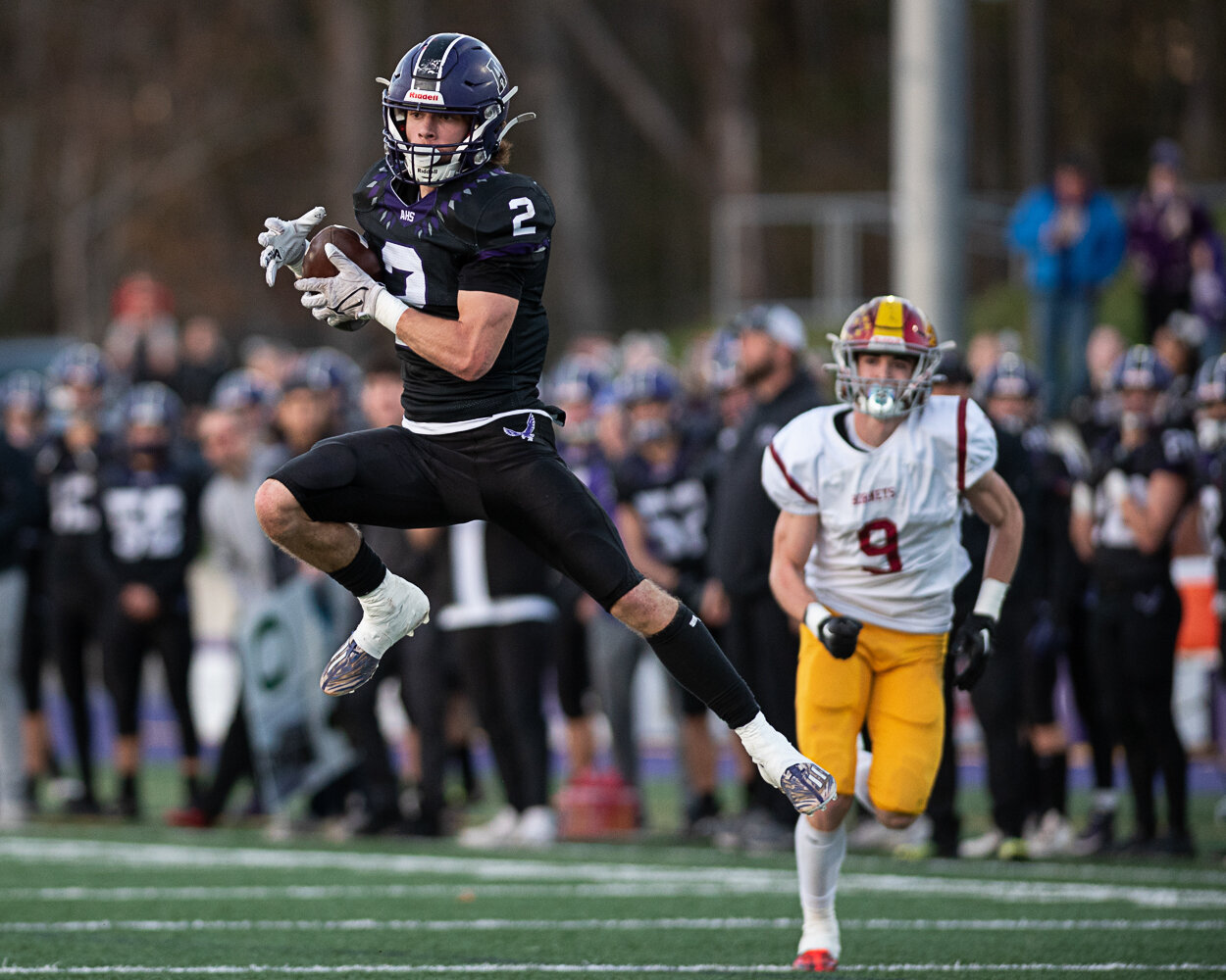 Anacortes’ Brady Beaner makes a catch before taking the ball to the end zone for a touchdown on Nov. 25 during the first half of a 2A state semifinal football game against Enumclaw.