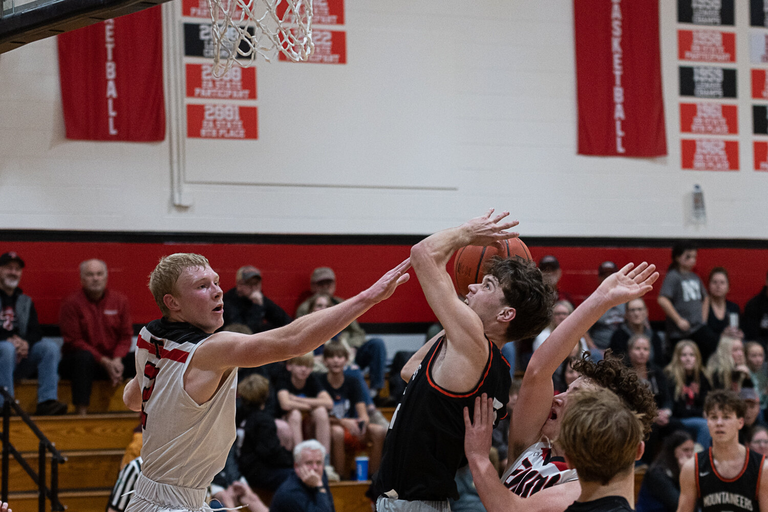 Jake Meldrum draws contact and a foul during Rainier's win over the Tenino on Nov. 30.