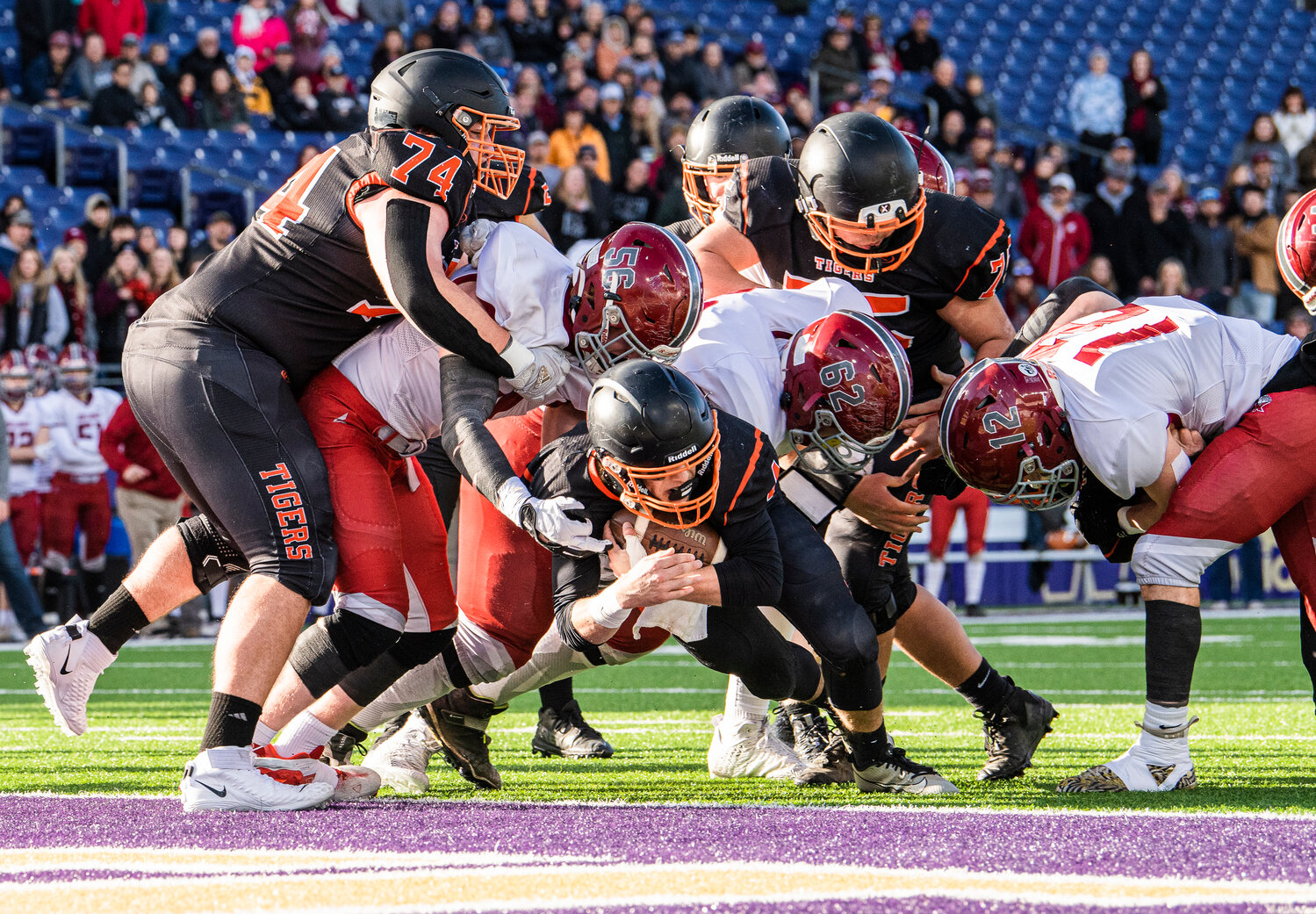 Napavine quarterback Ashton Demarest throws himself into the end zone for a touchdown during the 2B State Championship game against Okanogan at Husky Stadium on Saturday, Dec. 2.