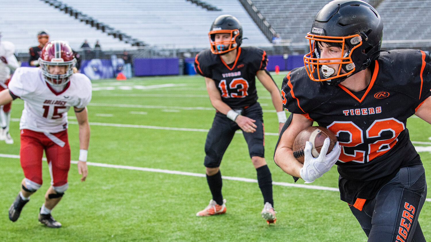Napavine’s Cayle Kelly (22) runs the ball down the field during the 2B State Championship game against Okanogan at Husky Stadium on Saturday, Dec. 2.