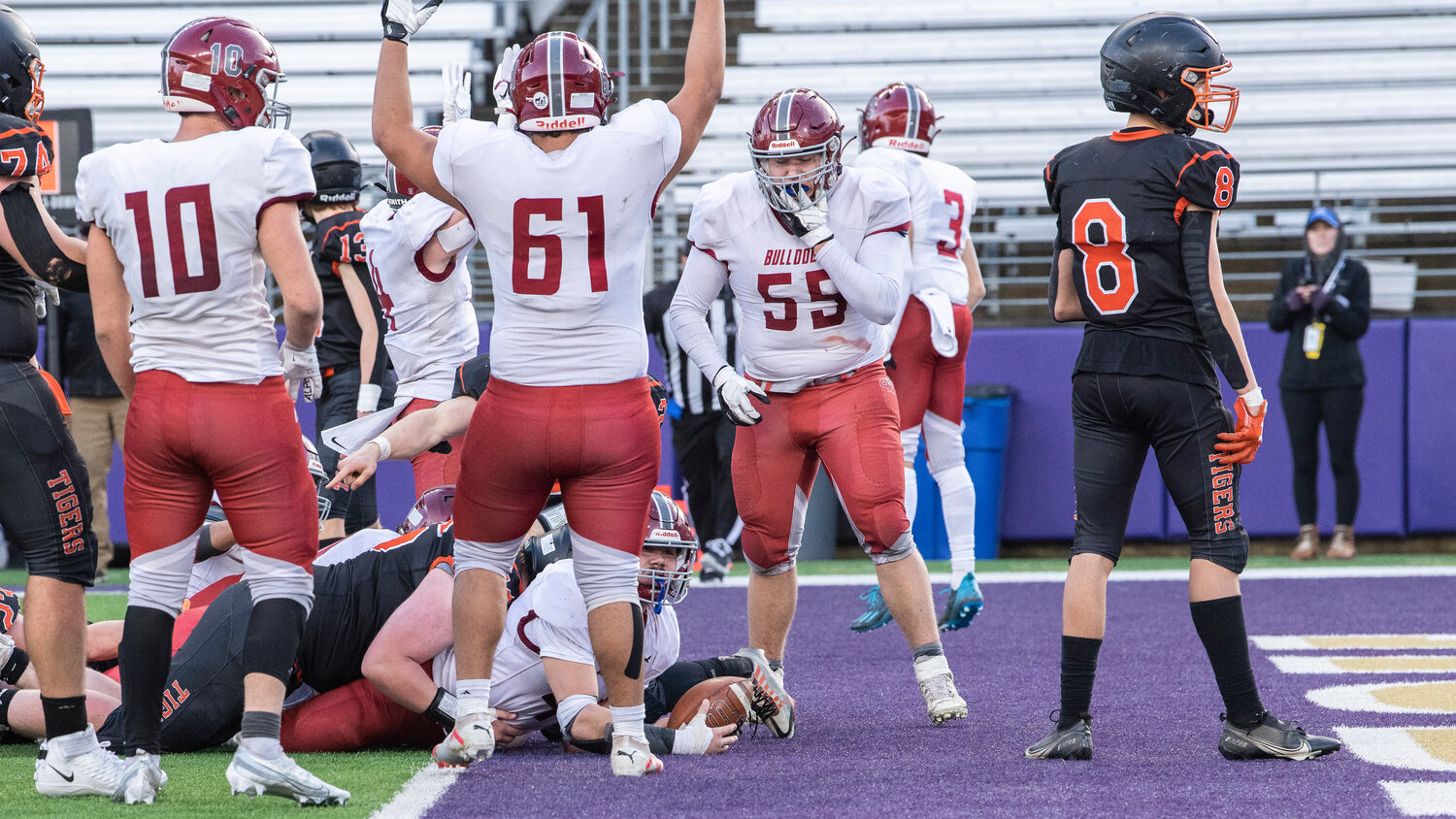 Okanogan’s Leo Cardenas celebrates as the Bulldogs score a touchdown in a matchup against Napavine for the 2B State Championship at Husky Stadium on Saturday, Dec. 2.