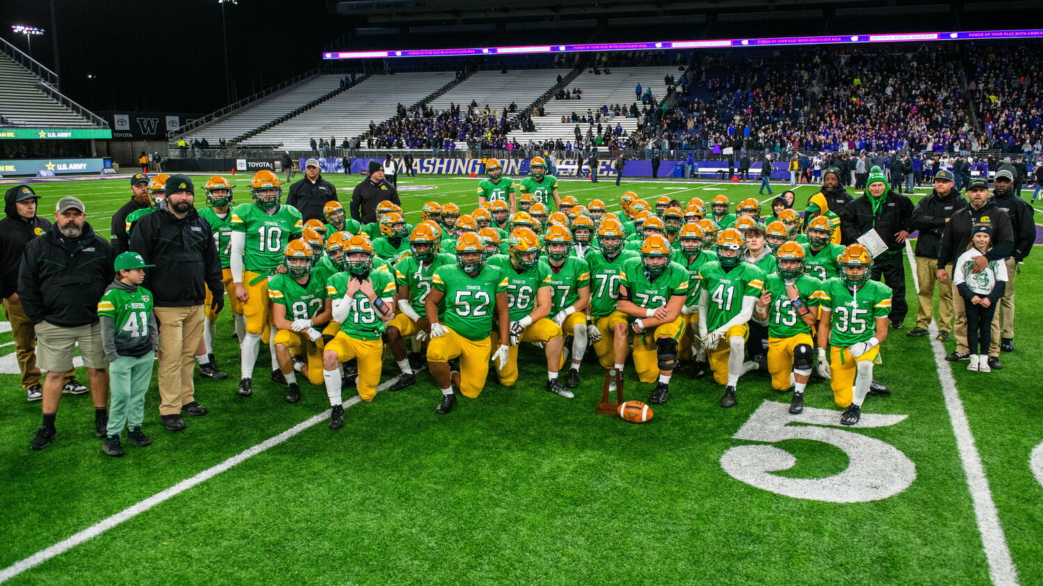 Tumwater poses for a photo with the second place trophy after a loss to Anacortes in the 2A State Championship game on Saturday, Dec. 2 at Husky Stadium.