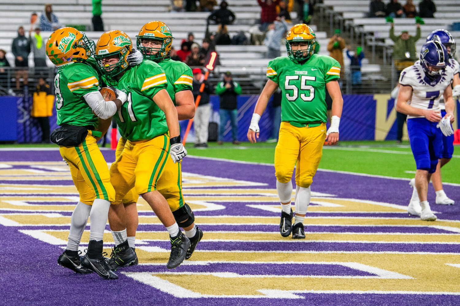 Tumwater Thunderbirds celebrate a touchdown during the 2A State Championship game at Husky Stadium in Seattle on Saturday.