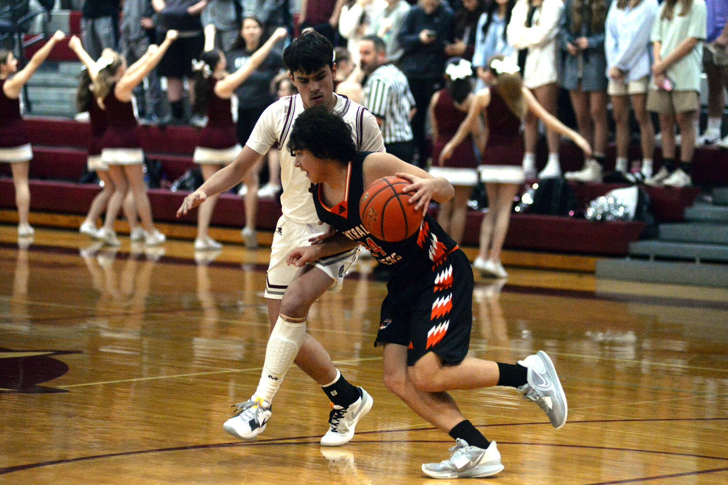 Centralia guard Jordan Yeung, right, dribbles against Montesano's Jaxson Wilson during a game at Montesano High School on Tuesday.