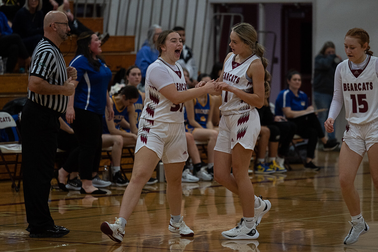 MaKenzie Dotson (left) celebrates with Joy Cushman after Cushman's buzzer-beater at the end of the second quarter during W.F. West's win over Rochester on Dec. 6.