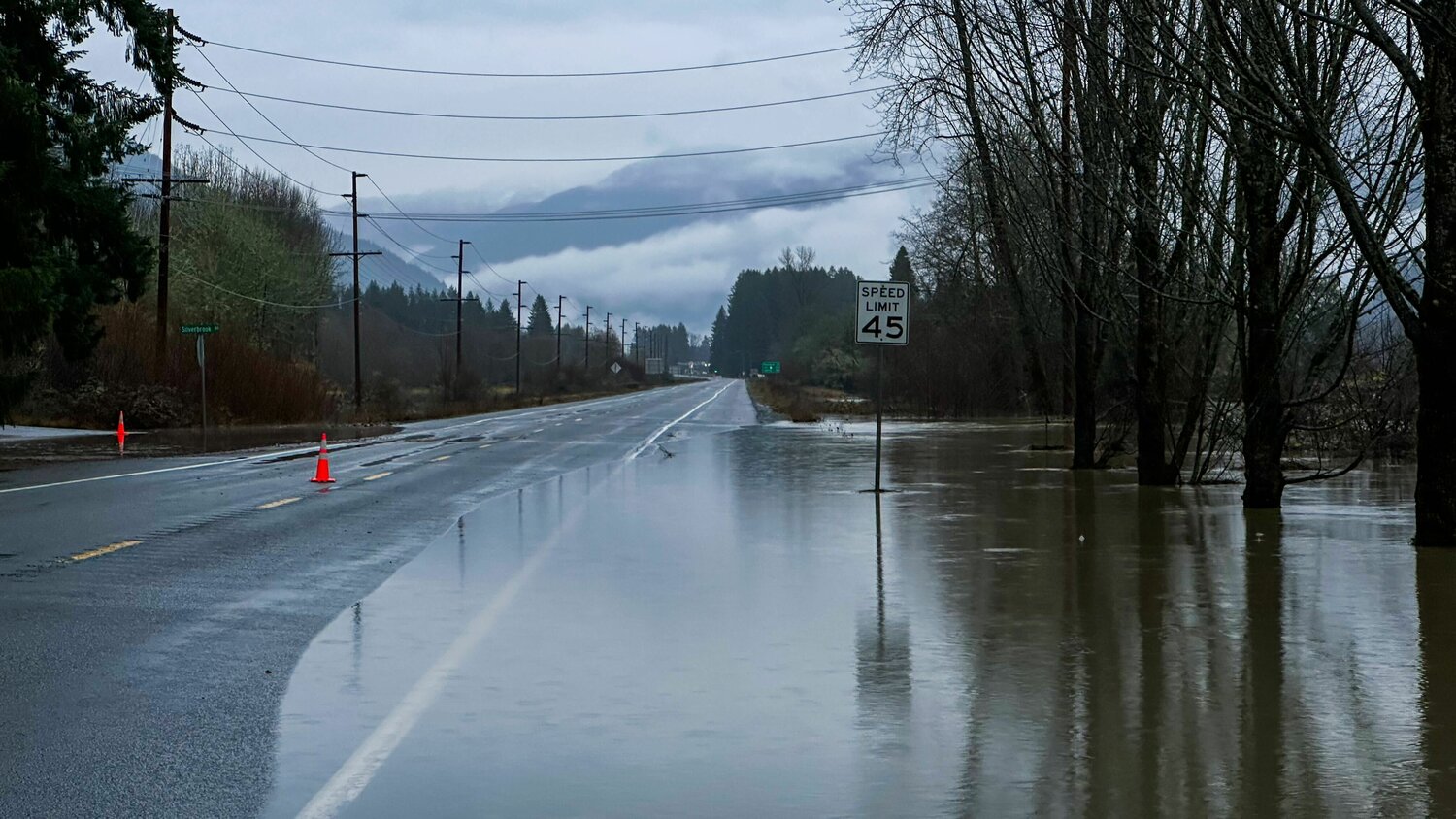 Water from the Cowlitz River creeps into lanes of Highway 12 in Randle on Wednesday, Dec. 6.