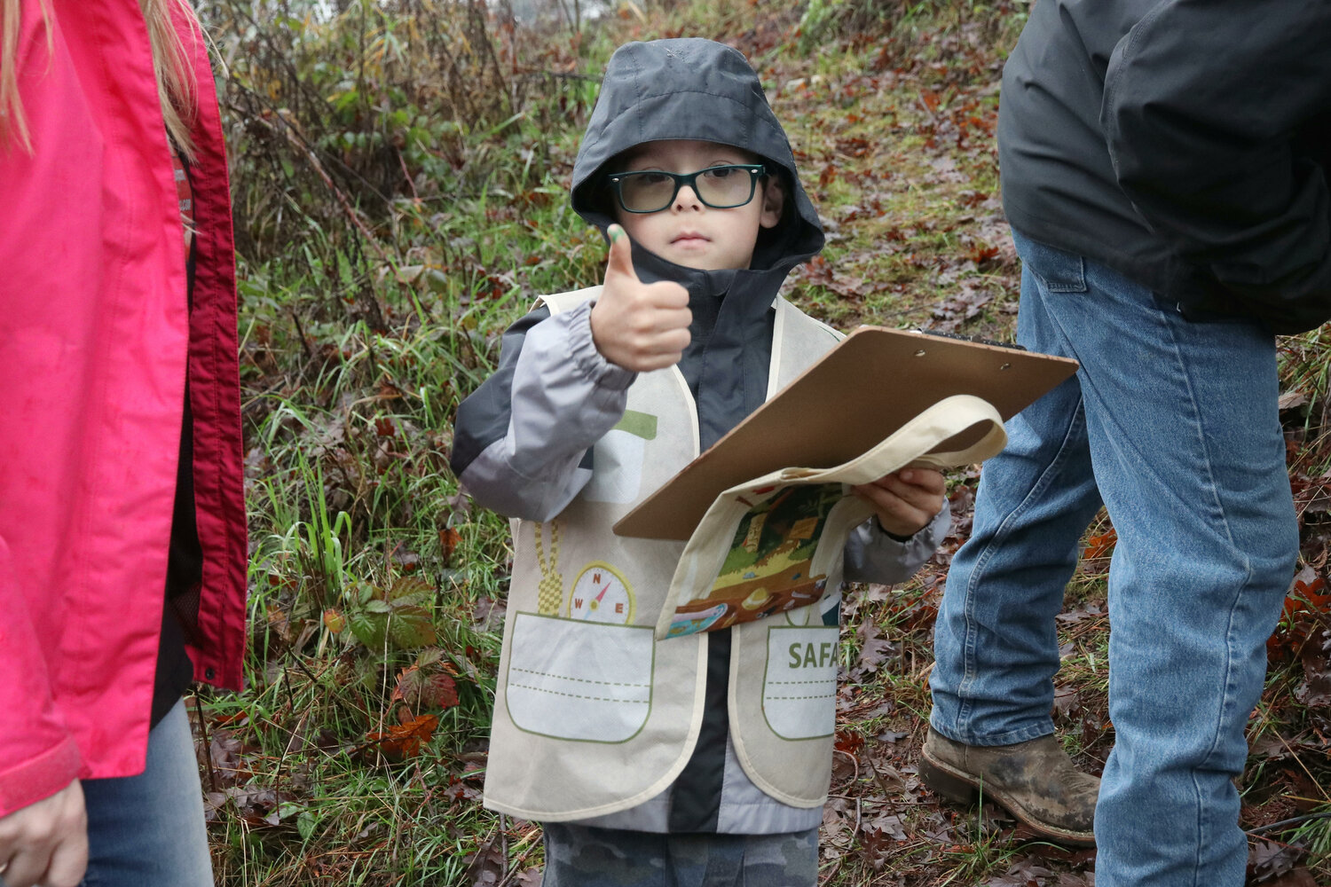 Owen, 5, gives a thumbs up to the camera during a nature hike at Sweet Tomatoes Learning Center in Chehalis on Wednesday, Dec. 6.