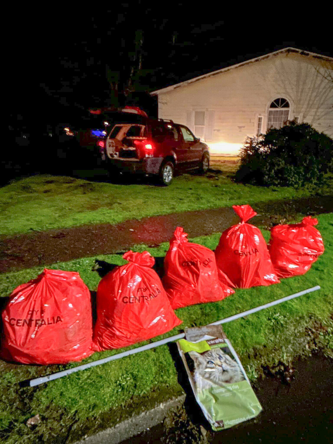 Multiple bags of trash collected by Centralia Clean Team volunteer Cindy Browne are seen left near the street along with discarded tubing and a cat food bag Browne collected while picking up trash in the Logan District on Dec. 5. Once filled, bags are left to be picked up by the Centralia Public Works Department.