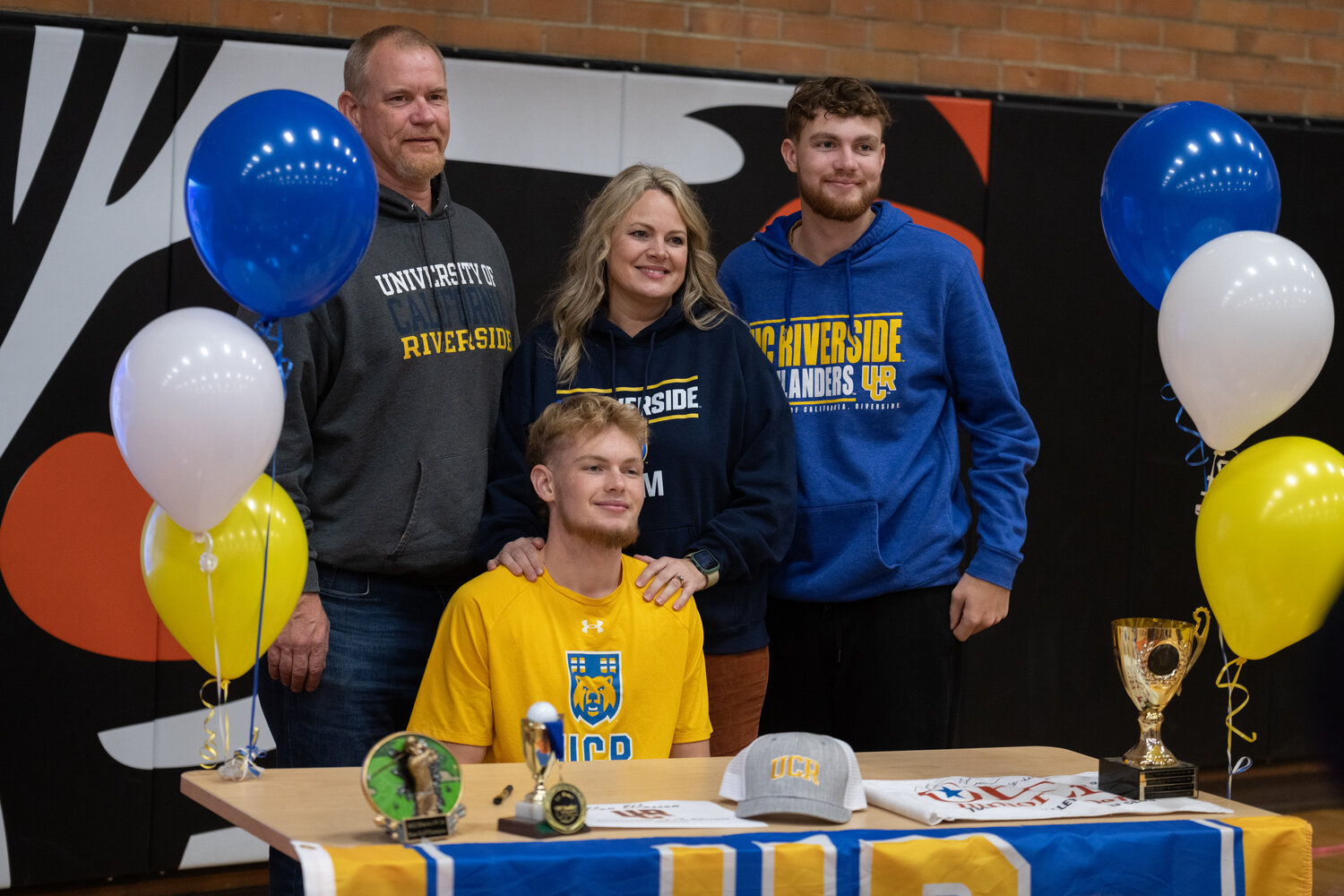 Von Wasson poses for a photo with his family after signing his NLI at a ceremony at Centralia High School on Dec. 8.