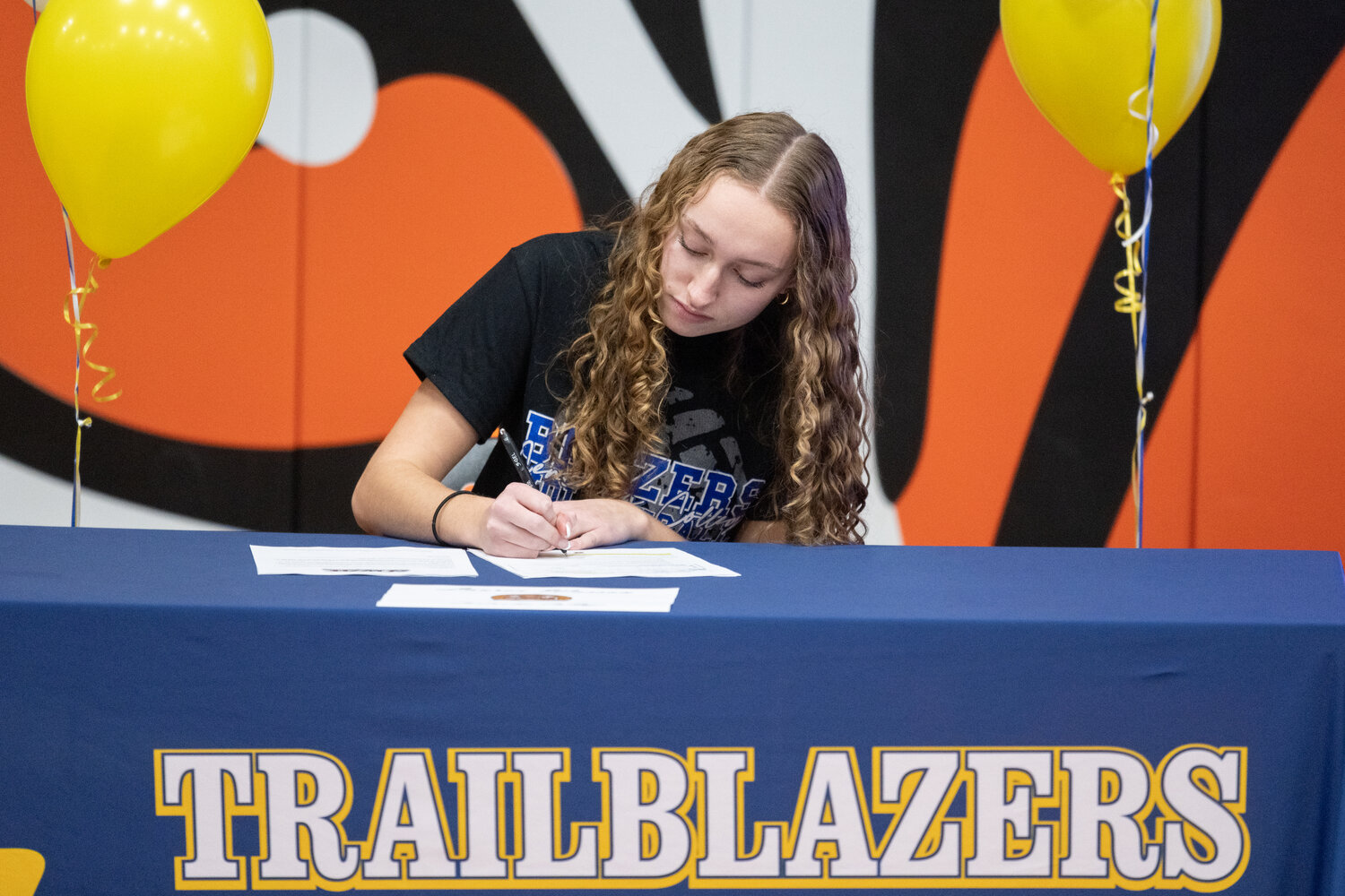 Lauren Wasson signs her letter of intent to play volleyball at Centralia College on Dec. 8 at Centralia High School.