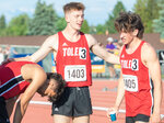 Toledo runners Jordan McKenzie, Conner Olmstead and John Rose catch their breath after winning the boys 4x400 meter 2B State championship during the track and field meet in Yakima on Saturday.